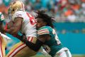 Rare sight:  Bobby McCain of the Miami Dolphins loses his helmet in a tackle.