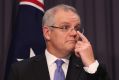 Treasurer Scott Morrison sees a budget surplus in 2020-21, although ratings agencies are not so sure.