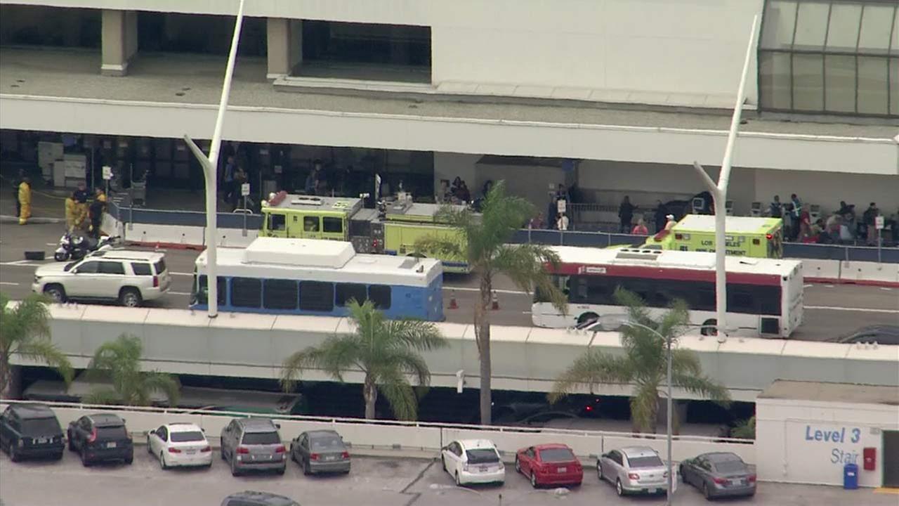 Emergency vehicles are seen parked at Los Angeles International Airport on Wednesday, Dec. 21, 2016.