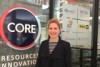 Tamryn Barker in front of sign for CORE Resources Innovation Centre