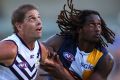 Aaron Sandilands and Nic Naitanui contest a ruck. They will not have to deal with a 'third man'.