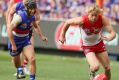 Breakout year: Isaac Heeney chases possession during the grand final against the Western Bulldogs.