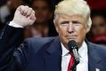 President-elect Donald Trump raises his fist as he speaks during the first stop of his post-election tour.