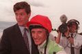 Champion in the saddle: James Packer congratulates Greg Hall after winning the Golden Slipper on Merlene.