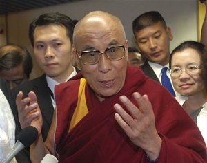 Tibetan spiritual leader the Dalai Lama talks to the media as he arrives at the Taoyuan International Airport, Sunday, Aug. 30, 2009, in Taoyuan county, Taiwan.