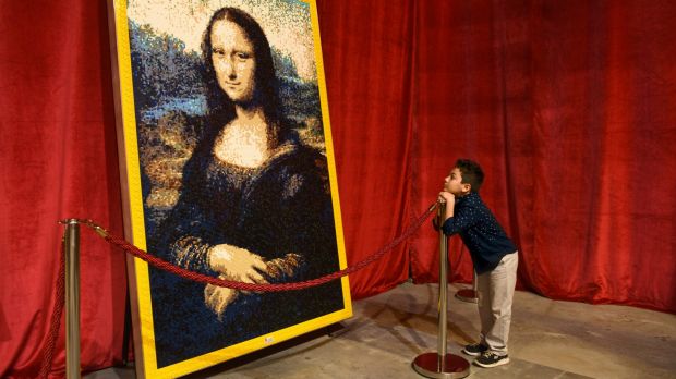 Elias Jose Raish admires a Lego construction of the <i>Mona Lisa</i>, part of an exhibition that features about 2 ...