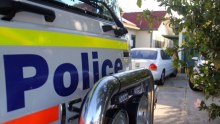 A police van outside a house.