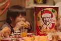 A KFC ad promoting the Kentucky Christmas buckets.