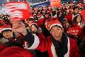 People wearing Santa Claus outfits calls for the resignation of South Korean President Park Geun-hye.