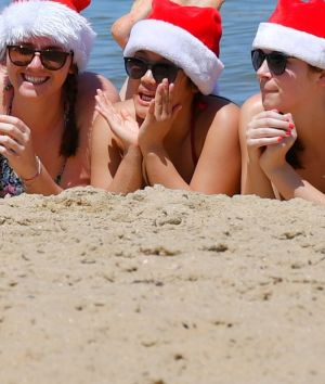 Christmas Day on st Kilda beach where the temperature has hit 36 degrees. 