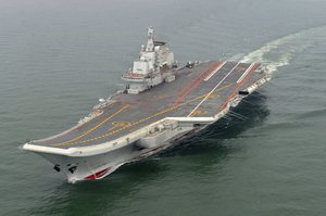 In this May 2012 file photo provided by China's Xinhua News Agency, Chinese aircraft carrier Liaoning cruises for a test in the sea.