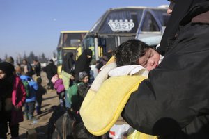 Syrians evacuated from the embattled Syrian city of Aleppo during the ceasefire arrive at a refugee camp in Rashidin, near Idlib, Syria, Tuesday, Dec. 20, 2016.