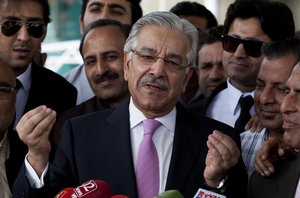 Pakistan's Defense Minister Khawaja Asif explains the position of Pakistan's Prime Minister Nawaz Sharif to reporters regarding the Panama Leaks' scandal, at the Supreme Court in Islamabad, Pakistan, Thursday, Nov. 3, 2016.