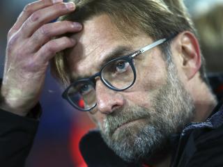 Liverpool's manager Juergen Klopp watches ahead of the English Premier League soccer match between Everton and Liverpool at Goodison Park stadium in Liverpool, England, Monday, Dec. 19, 2016. (AP Photo/Dave Thompson)