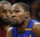 Golden State's Kevin Durant, left, drives to the basket against Cavalier Richard Jefferson.