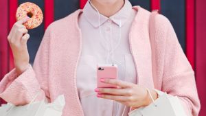 Pink Shopping Lady with doughnut using technology