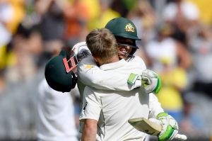 David Warner and Usman Khawaja embrace during their MCG runfest.