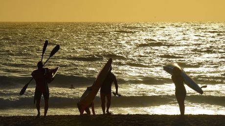 People about to enter the water with their kayaks early on Wednesday morning at Maroubra Beach.