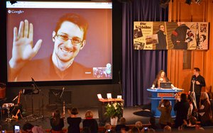 File - The International League for Human Rights awards the 2014 Carl von Ossietzky Medal to Edward Snowden, Laura Poitras and Glen Greenwald.