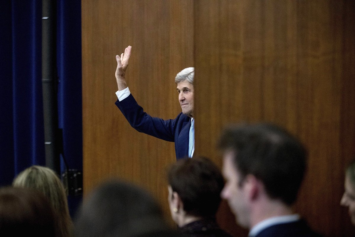 Secretary of State John Kerry waves to members of the audience as he departs after speaking at the State Department in Washington, Wednesday, Dec. 28, 2016. Stepping into a raging diplomatic argument, Kerry staunchly defended the Obama administration's decision to allow the U.N. Security Council to declare Israeli settlements illegal and warned that Israel's very future as a democracy is at stake. (AP Photo/Andrew Harnik)