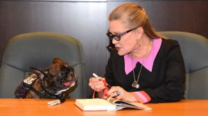 LOS ANGELES, CA - NOVEMBER 28:  Carrie Fisher (R) and her dog Gary Fisher (L) sign copies of her new book "The Princess ...