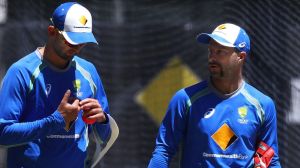 ADELAIDE, AUSTRALIA - NOVEMBER 23: Nathan Lyon of Australia speaks to Matthew Wade of Australia during an Australian ...