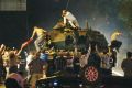 Civilians attempt to stop a tank in the Turkish capital Ankara during the coup attempt on July 16, 2016. 