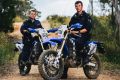 (L-R) Constables Trevor Gay and Scott Burrows with the ACT Police trail bikes used to patrol ACT National Parks.