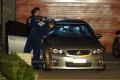 Forensic police examine gunshots in a car outside an Aveley home. 