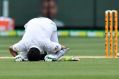 Patient and tough: Pakistan's Azhar Ali kisses the ground after scoring a century against Australia on the second day of ...