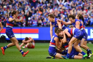 Sweet victory. The Bulldogs celebrate their grand final win over the Swans.