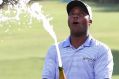 Spray it again: Harold Varner of the US celebrates after winning the Australian PGA Championship. 