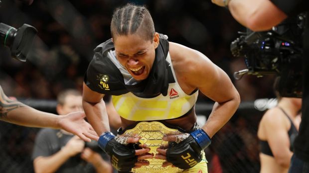 Amanda Nunes celebrates after winning the UFC's  women's bantamweight championship.