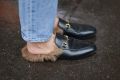 Linda Tol poses wearing Gucci loafers before the Jil Sander show during the Milan Fashion Week Fall/Winter 2016/17 on ...