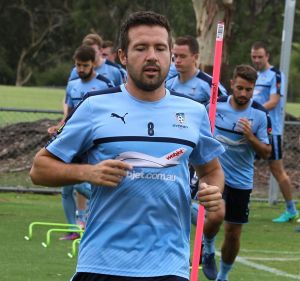 Strong finishers: Milos Dimitrijevic leads Sydney FC through their final training session on Thursday before their clash ...