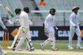 Nic Maddinson walks off after being bowled by Pakistan's Yasir Shah on day four of the MCG Test.