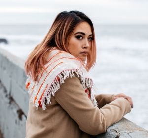 Portrait of young fashionable stylish female outdoors in nature