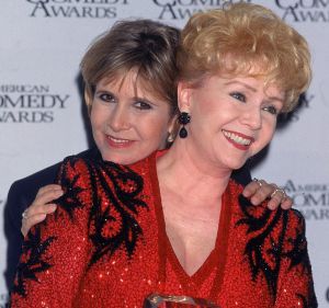 (L-R) Actress Carrie Fisher hugging mother, entertainer Debbi Reynolds, at American Comedy Awards.  (Photo by Mirek ...