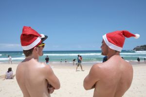 SYDNEY, AUSTRALIA - DECEMBER 23: UK tourists, Nick Ward and Alistair Comlay check out the best spots on Bondi Beach for ...