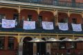 Some of the offensive banners which have forced the Brass Monkey Hotel into issuing an apology. 