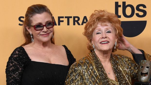 Carrie Fisher, left, and Debbie Reynolds at the 21st Annual Screen Actors Guild Awards in 2015.
