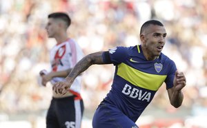 Boca Juniors' forward Carlos Tevez celebrates scoring against River Plate during a local tournament soccer match in Buenos Aires, Argentina, Sunday, Dec. 11, 2016