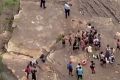 Police and bystanders at Mermaid Pools in Tahmoor on Friday afternoon.