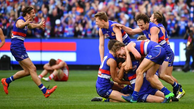 Sweet victory. The Bulldogs celebrate their grand final win over the Swans.