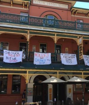 Some of the offensive banners which have forced the Brass Monkey Hotel into issuing an apology. 