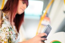 Woman using phone (Getty Images)