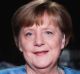 German Chancellor Angela Merkel poses for photographs after the television recording of her annual New Year's speech at ...