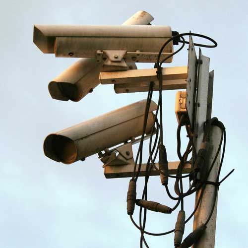 “Surveillance Cameras” by Quevaal, licensed under CC BY-SA 3.0 / cropped.