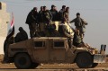 Iraqi Army soldiers inspect defenses in the eastern section of Mosul, Iraq, Friday, Dec. 30, 2016. Iraq's special forces ...