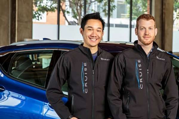 Dan Ammann, right, president of General Motors, with the co-founders of Cruise Automation, Kyle Vogt, center, and Daniel Kan.